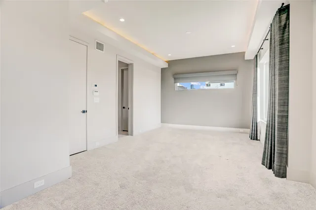 a view of a room with a large window