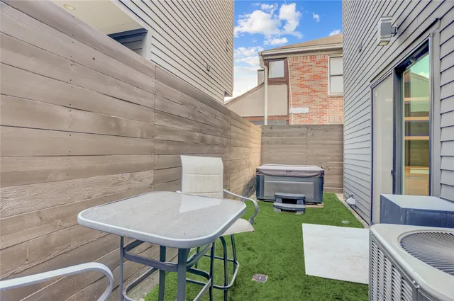 a kitchen with kitchen island a counter top space a sink stainless steel appliances and cabinets