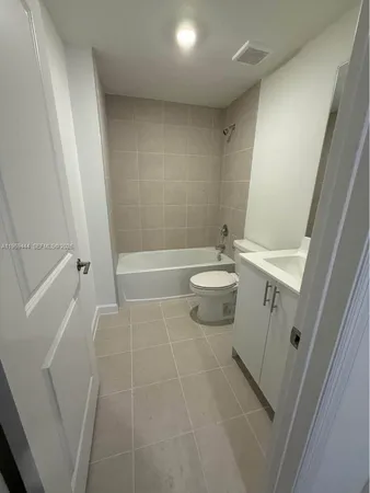a bathroom with a bathtub sink and toilet