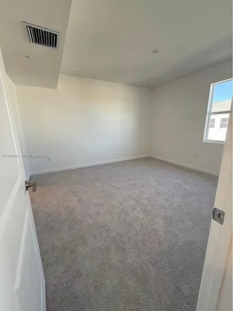 view of room with window and hardwood floor