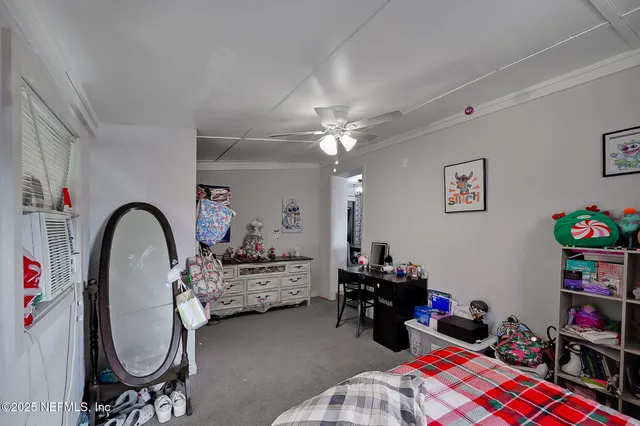 a bedroom with bed a gym equipment