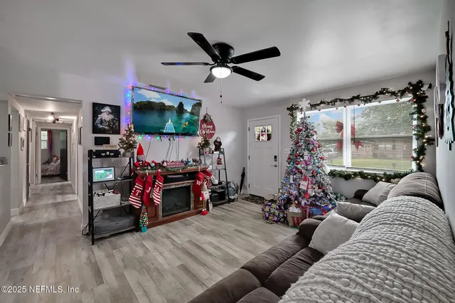 a living room with furniture and a flat screen tv