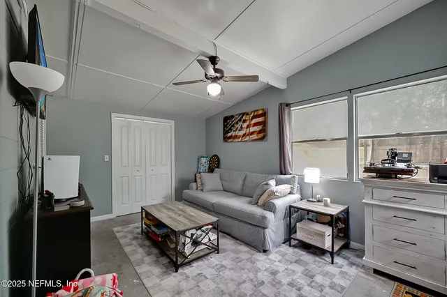 a living room with furniture and a window