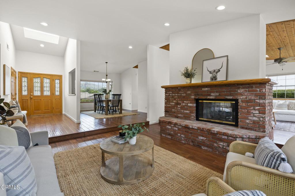 116 Via Pasito Ventura, CA 93003 - Photo 11 of 61 a living room with furniture and a fireplace