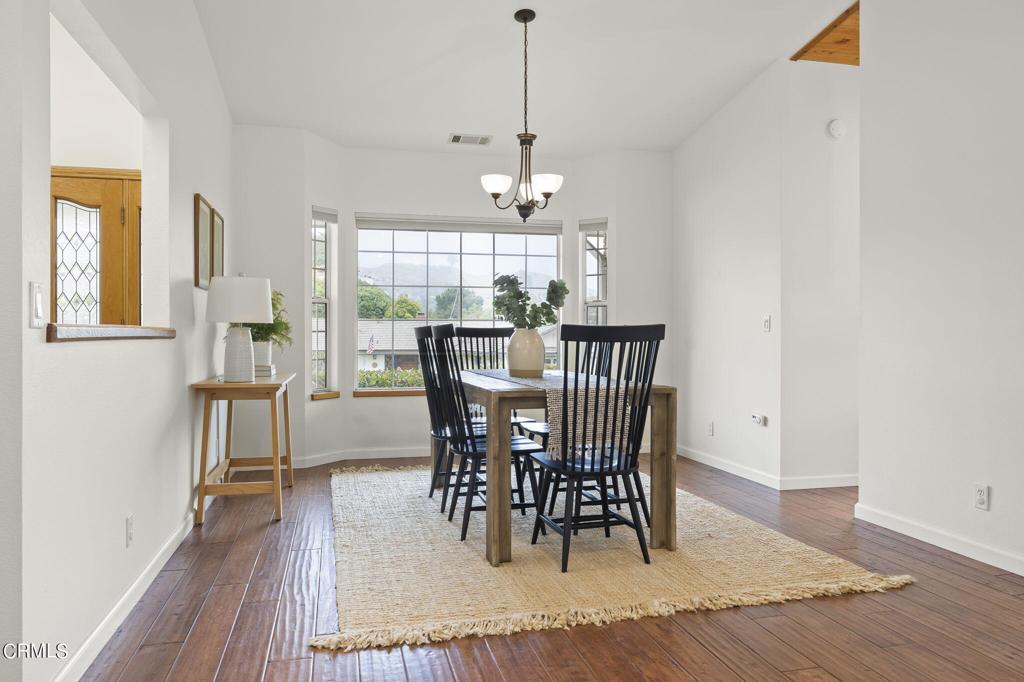 116 Via Pasito Ventura, CA 93003 - Photo 12 of 61 a view of a dining room with furniture window and wooden floor