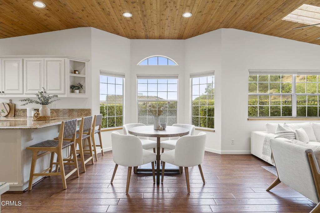 116 Via Pasito Ventura, CA 93003 - Photo 14 of 61 a view of a dining room with furniture window and wooden floor