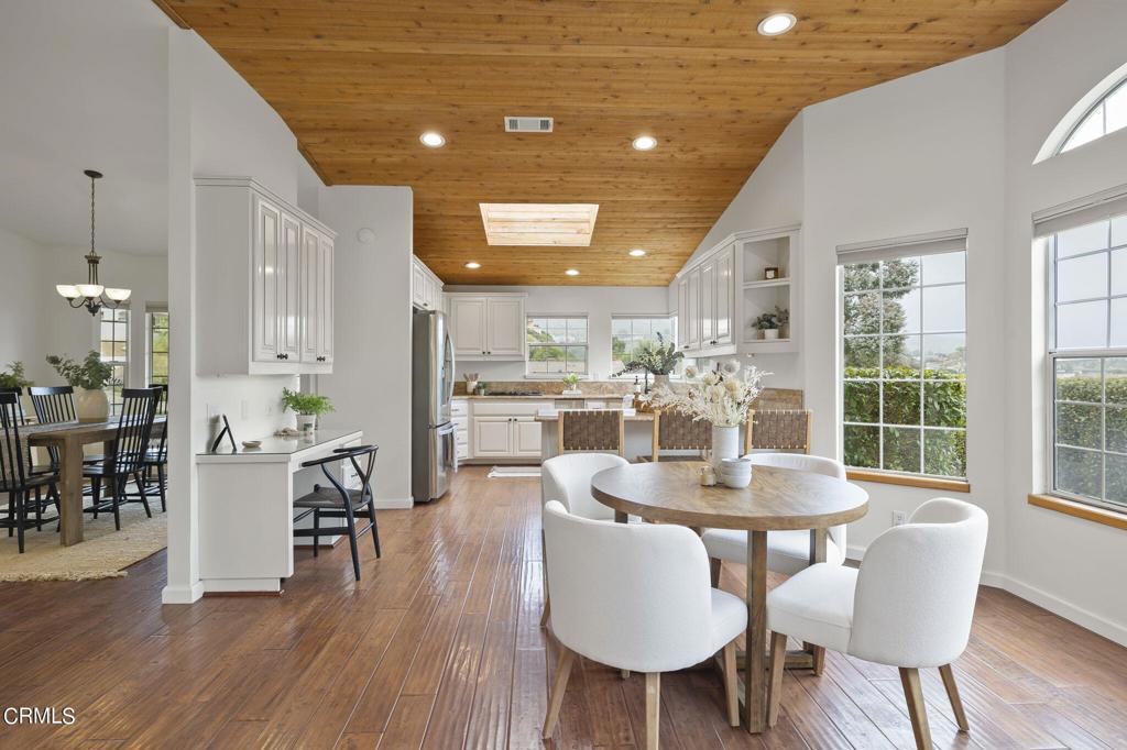 116 Via Pasito Ventura, CA 93003 - Photo 19 of 61 a dining room with furniture a chandelier and wooden floor