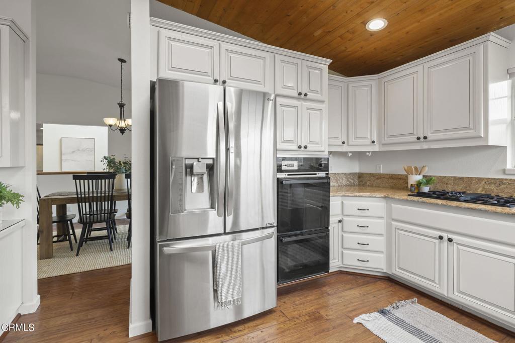 116 Via Pasito Ventura, CA 93003 - Photo 24 of 61 a kitchen with stainless steel appliances a refrigerator sink and cabinets