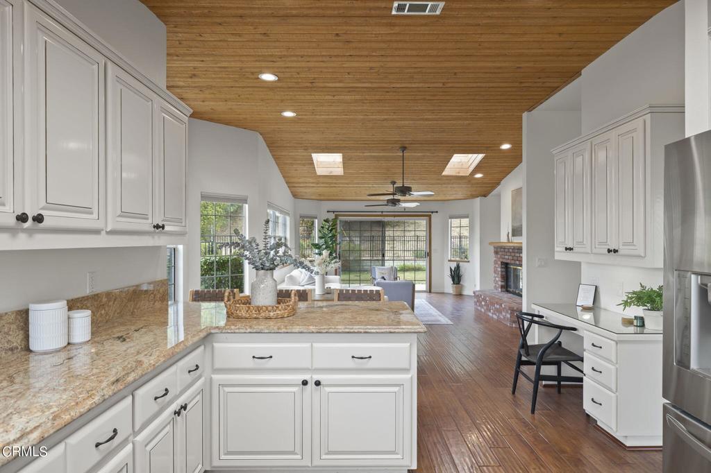 116 Via Pasito Ventura, CA 93003 - Photo 25 of 61 a kitchen with granite countertop white cabinets and white appliances