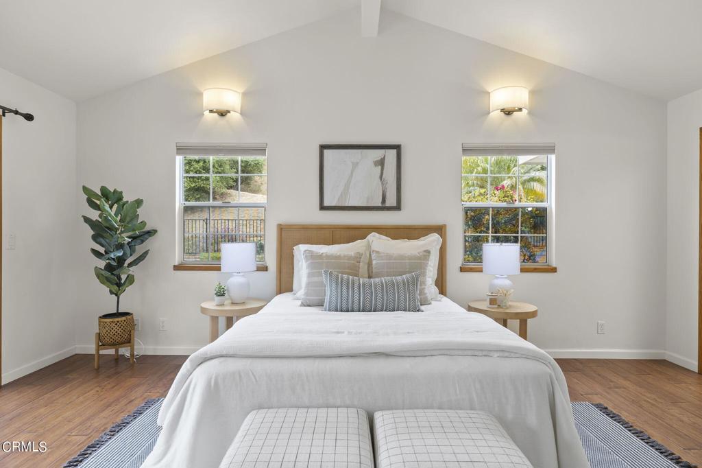 116 Via Pasito Ventura, CA 93003 - Photo 27 of 61 a bedroom with a large bed and a potted plant