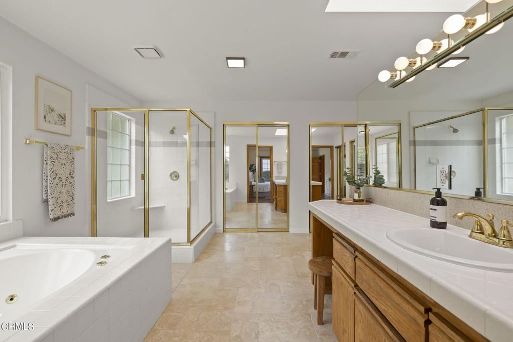 116 Via Pasito Ventura, CA 93003 - Photo 29 of 61 a spacious bathroom with a shower a sink a mirror a bathtub and shower