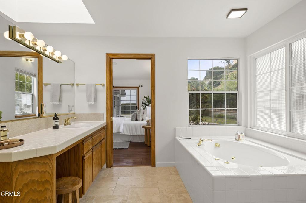 116 Via Pasito Ventura, CA 93003 - Photo 30 of 61 a spacious bathroom with a tub sink and mirror