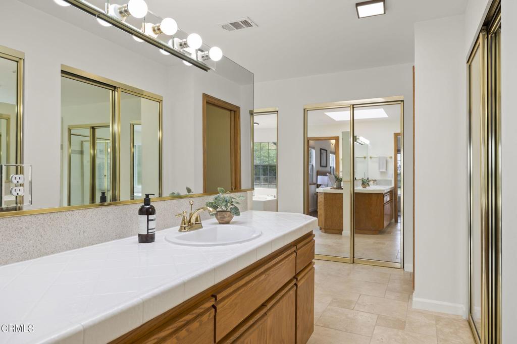 116 Via Pasito Ventura, CA 93003 - Photo 33 of 61 a bathroom with a sink double vanity and a shower