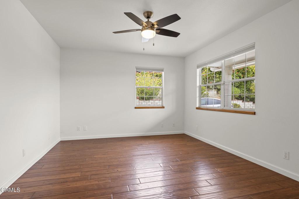 116 Via Pasito Ventura, CA 93003 - Photo 34 of 61 a view of an empty room with window and wooden floor