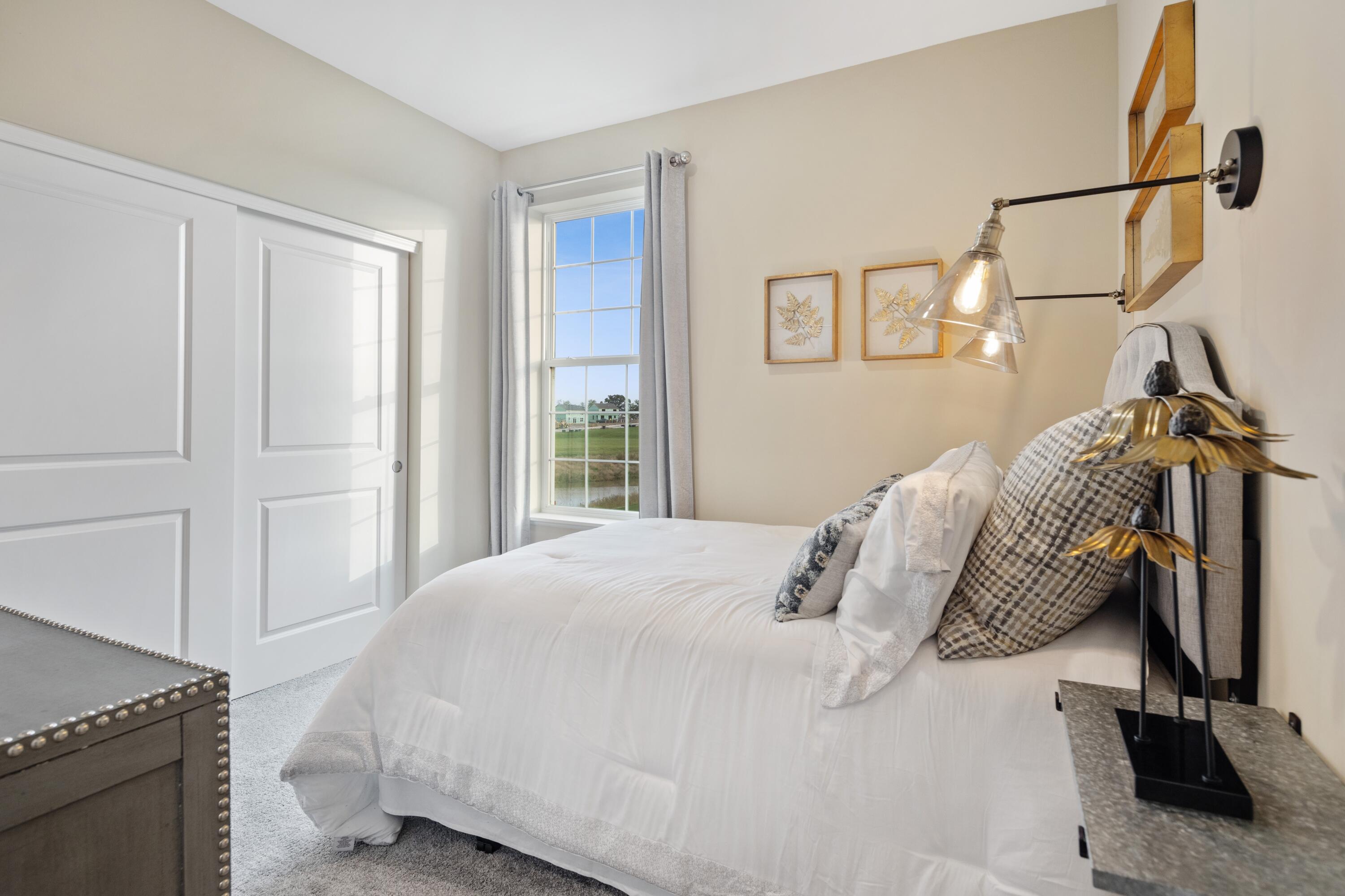8468 Graystone Drive Lowell, IN 46356 - Photo 11 of 14 a bedroom with a bed and a window