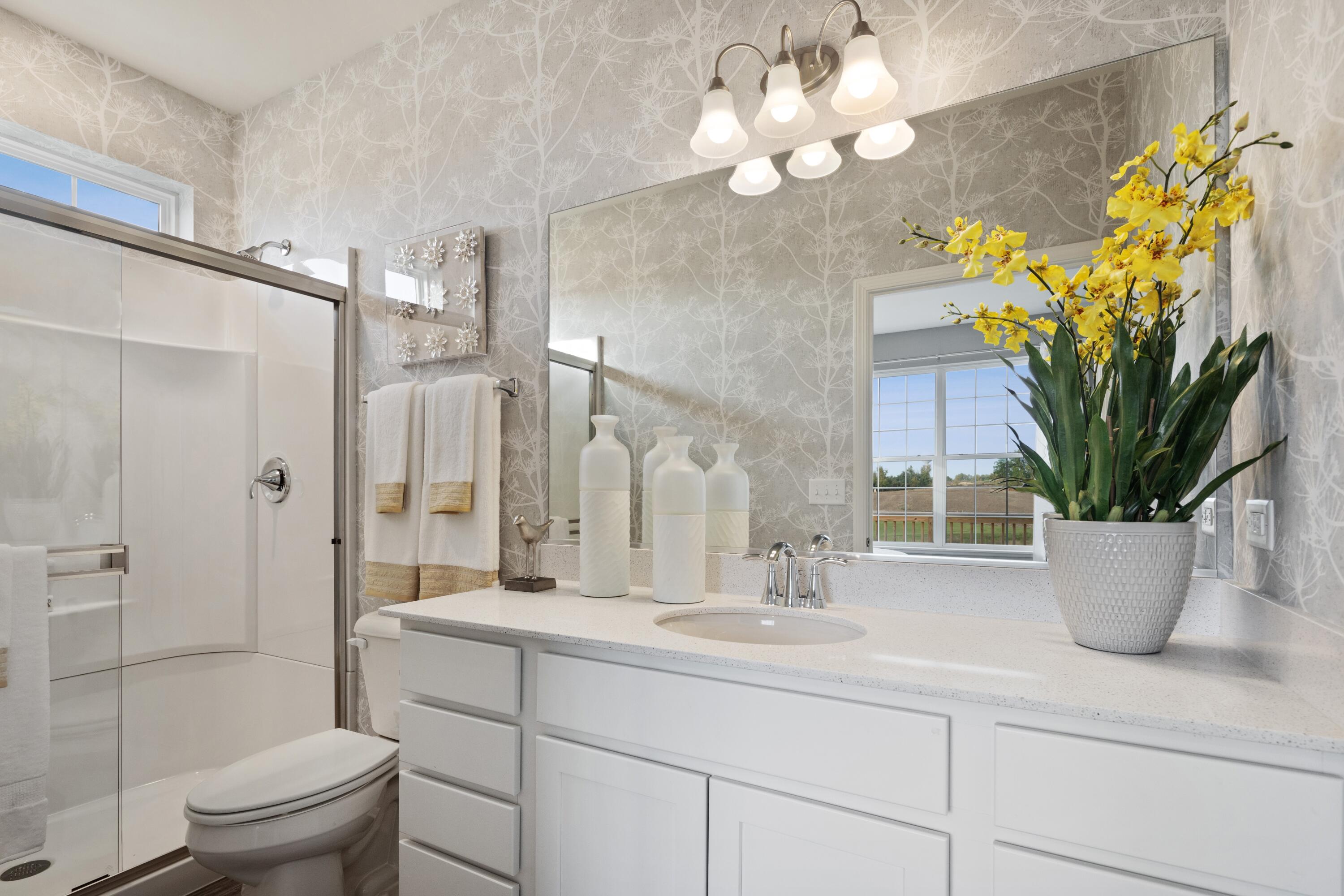 8468 Graystone Drive Lowell, IN 46356 - Photo 12 of 14 a bathroom with a potted plant and a sink