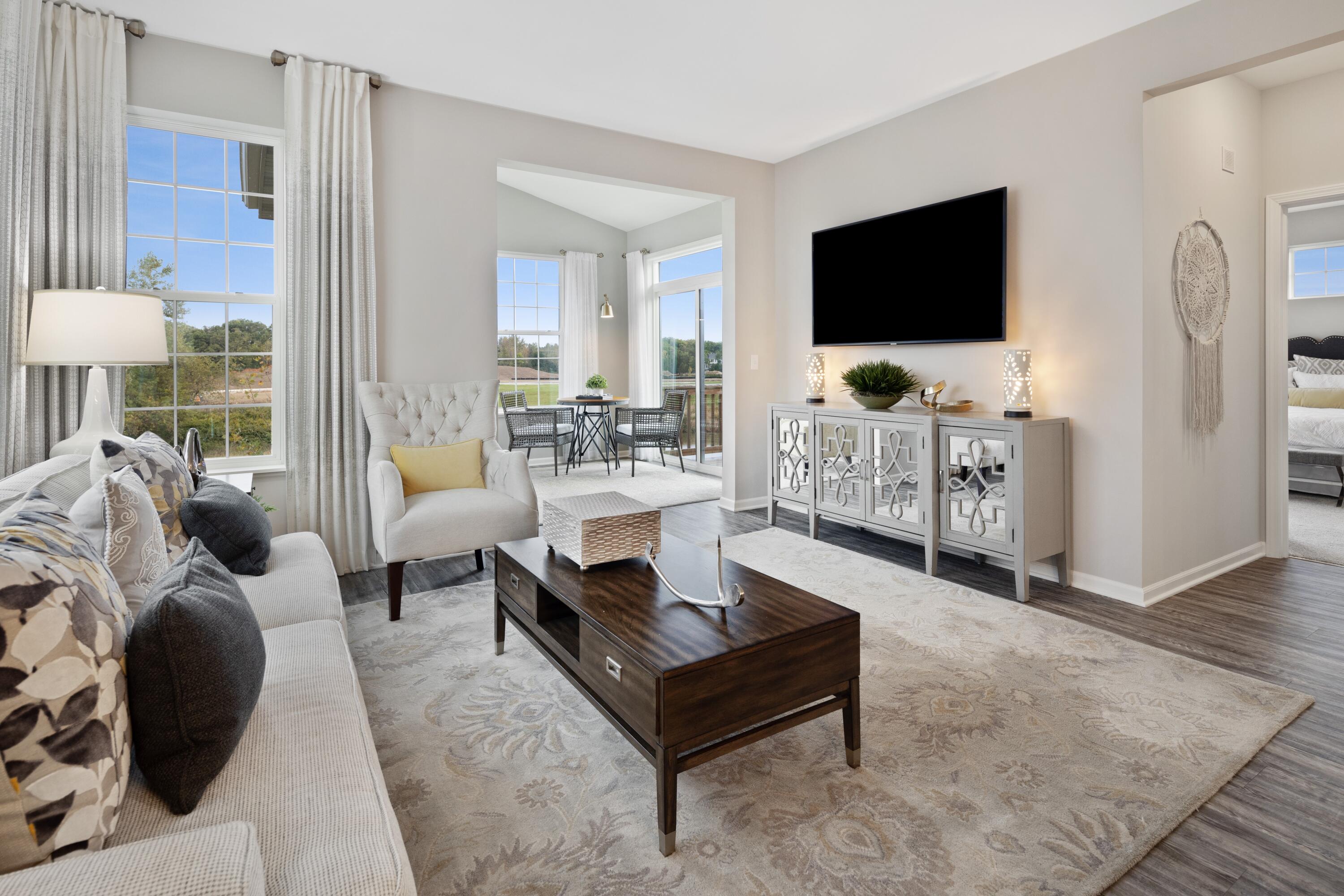8468 Graystone Drive Lowell, IN 46356 - Photo 3 of 14 a living room with furniture and a flat screen tv
