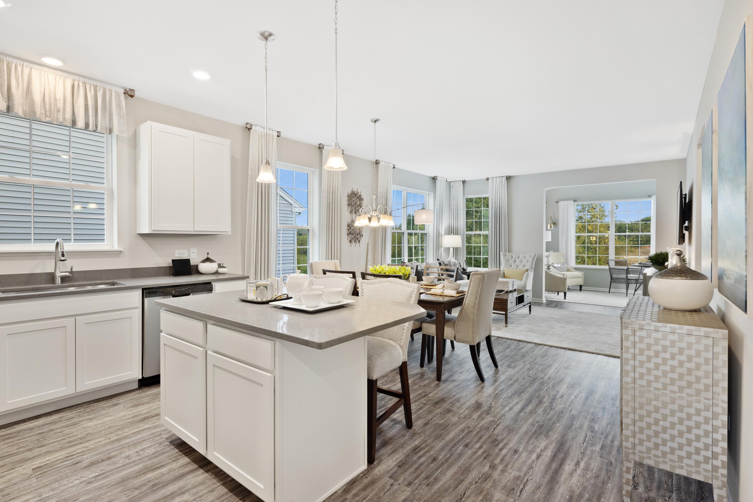 8468 Graystone Drive Lowell, IN 46356 - Photo 8 of 14 a kitchen with a sink stove and wooden floor