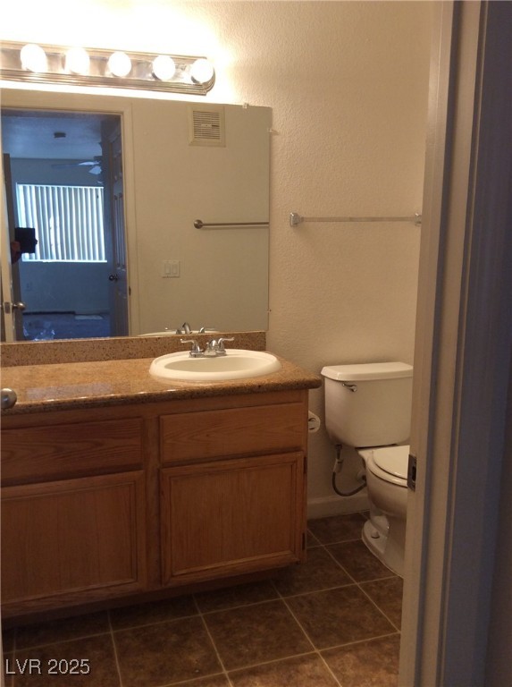 3318 North Decatur Boulevard, Unit 2077 Las Vegas, NV 89130 - Photo 17 of 19 Bathroom with tile patterned floors and vanity