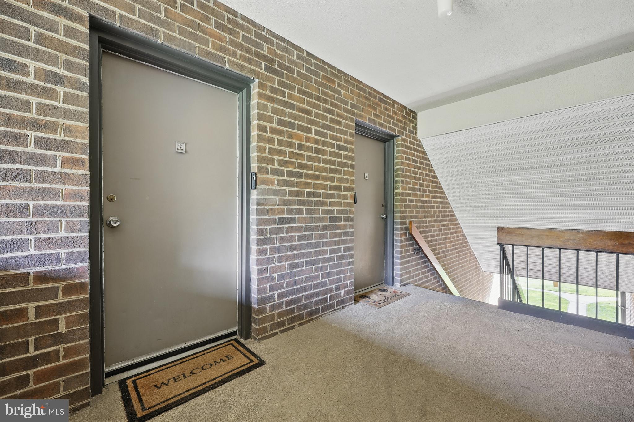 2107 Walsh View Terrace, Unit 14301 & 304 Silver Spring, MD 20902 - Photo 2 of 54 a view of a livingroom with a staircase