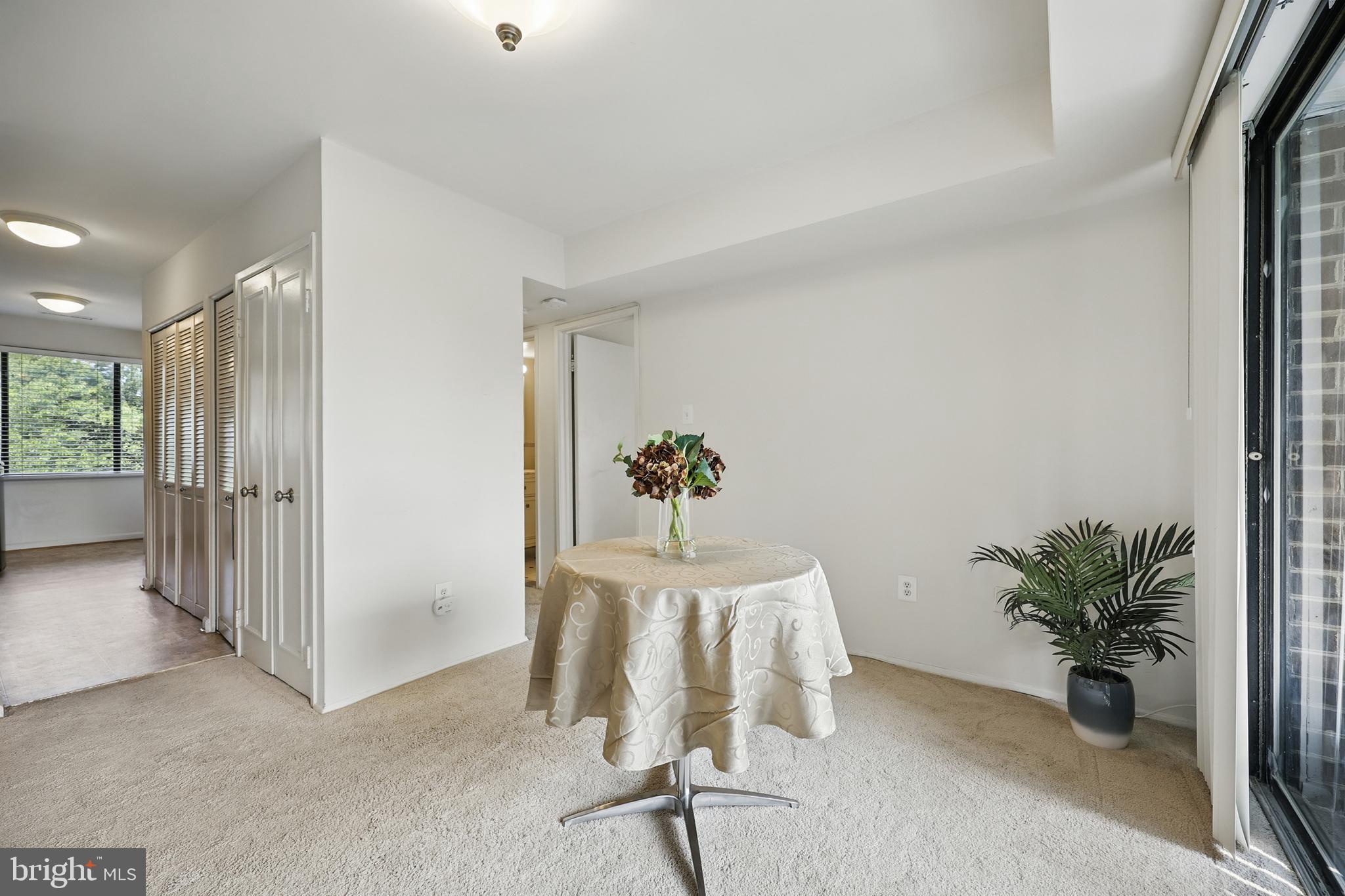 2107 Walsh View Terrace, Unit 14301 & 304 Silver Spring, MD 20902 - Photo 8 of 54 a workspace with furniture and a potted plant