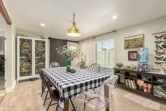 a view of a dining room with furniture window and outside view