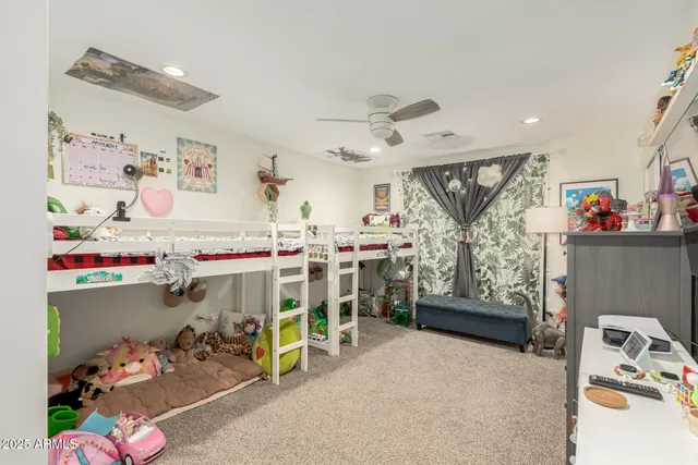 a storage room with lots of clutter and refrigerator