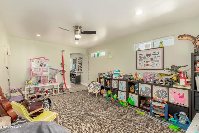 a view of a play room with toys and a wooden floor