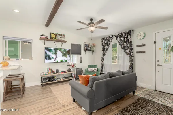 a living room with furniture and a large window