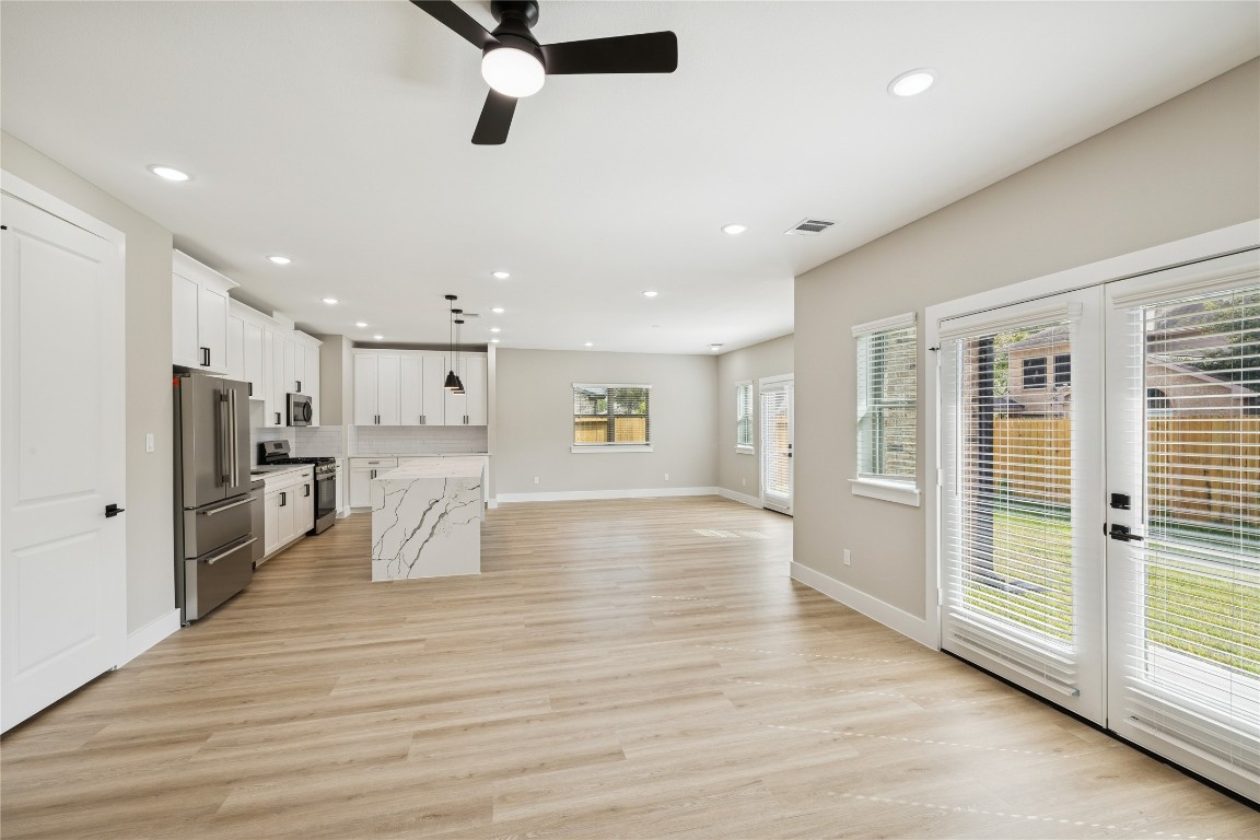 2614 Liguria Lane Spring, TX 77388 - Photo 5 of 23 Spacious and inviting family room with abundant natural light and seamless flow to the kitchen and backyard.