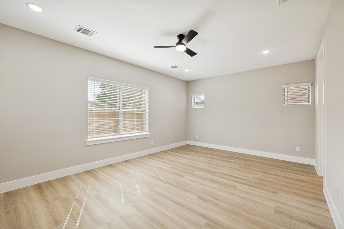 2614 Liguria Lane Spring, TX 77388 - Photo 10 of 23 Spacious primary bedroom with abundant natural light and modern finishes.