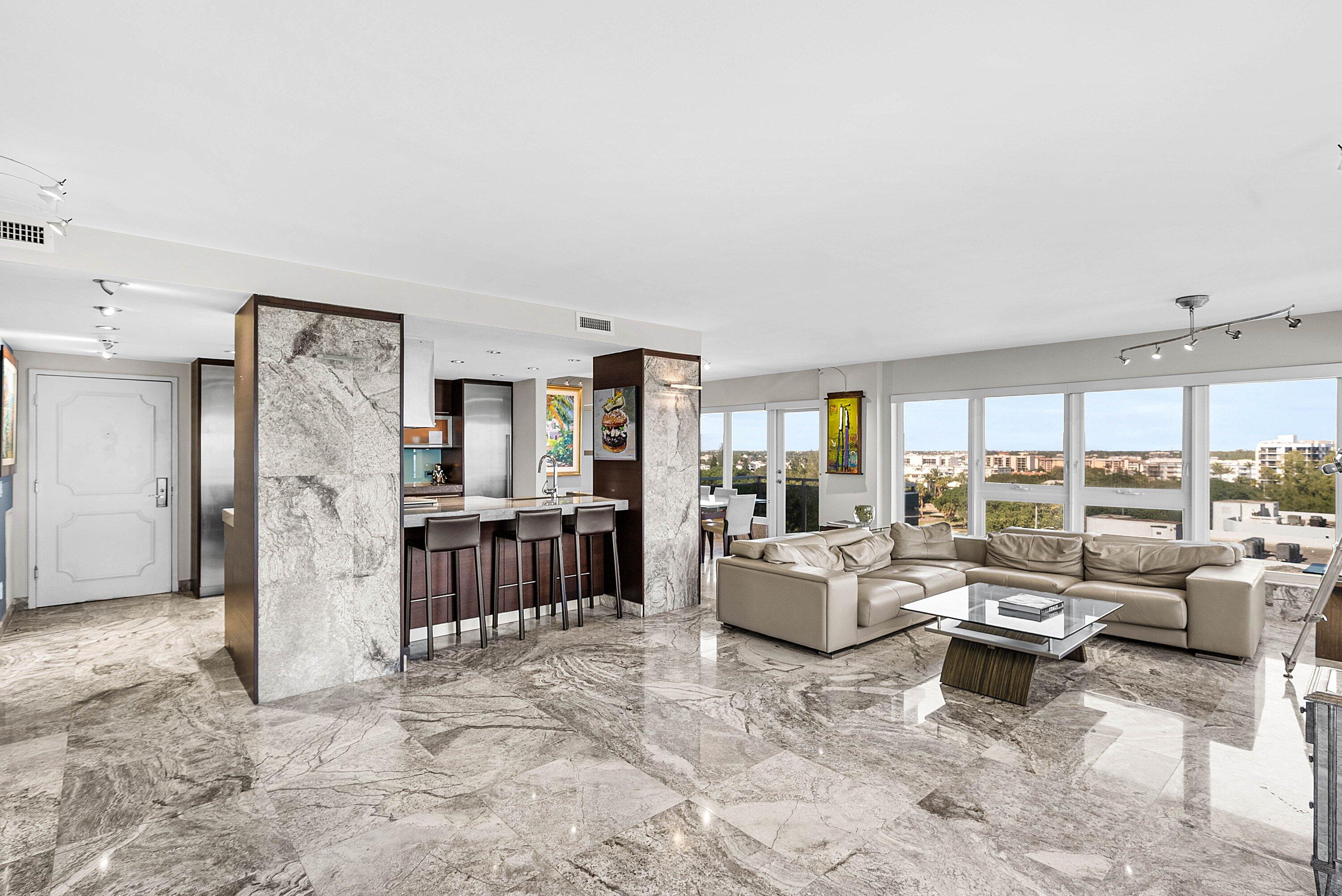 2066 North Ocean Boulevard, Unit 9NE Boca Raton, FL 33431 - Photo 13 of 45 a living room with furniture and a large window