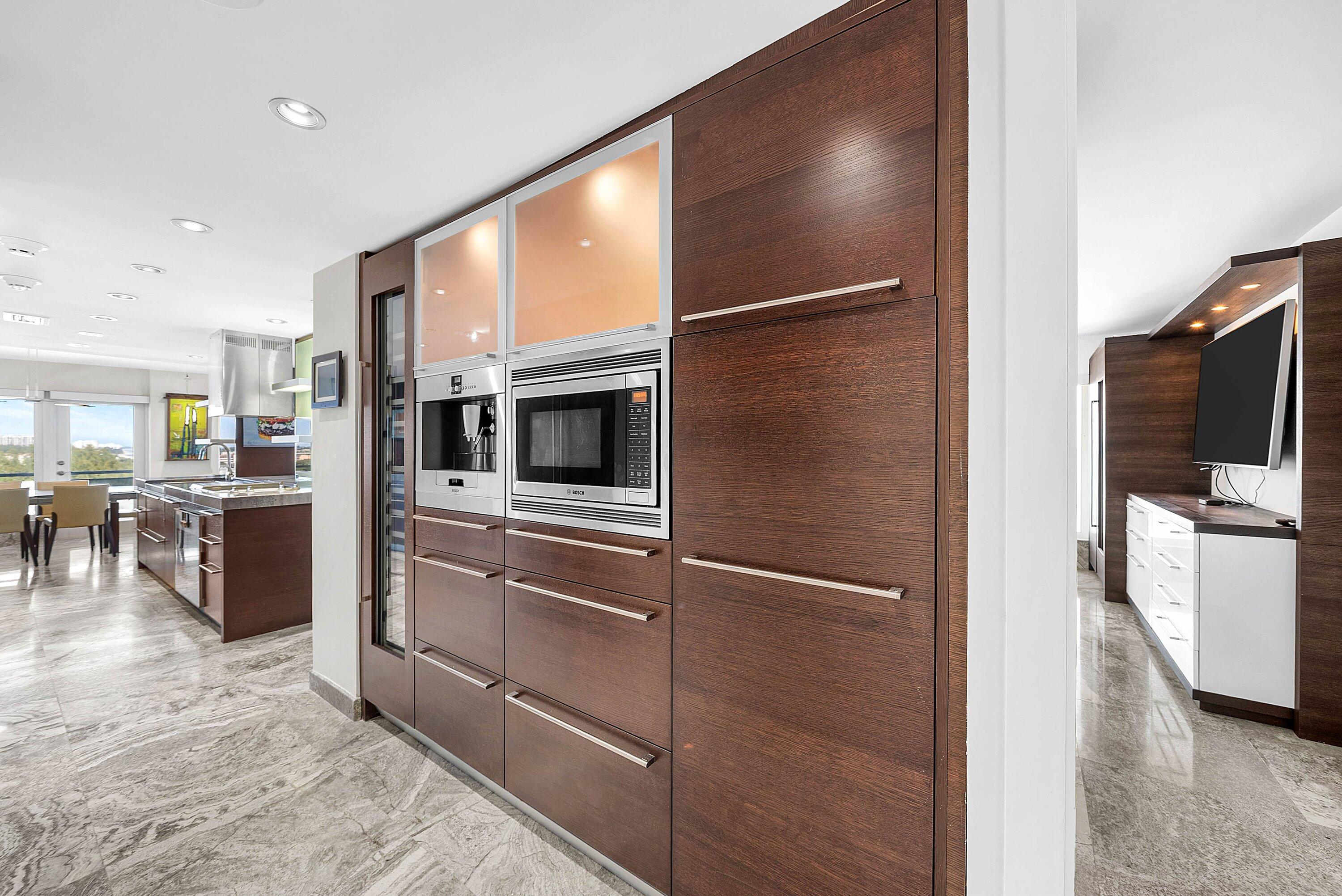 2066 North Ocean Boulevard, Unit 9NE Boca Raton, FL 33431 - Photo 15 of 45 a kitchen with stainless steel appliances granite countertop a refrigerator and a stove
