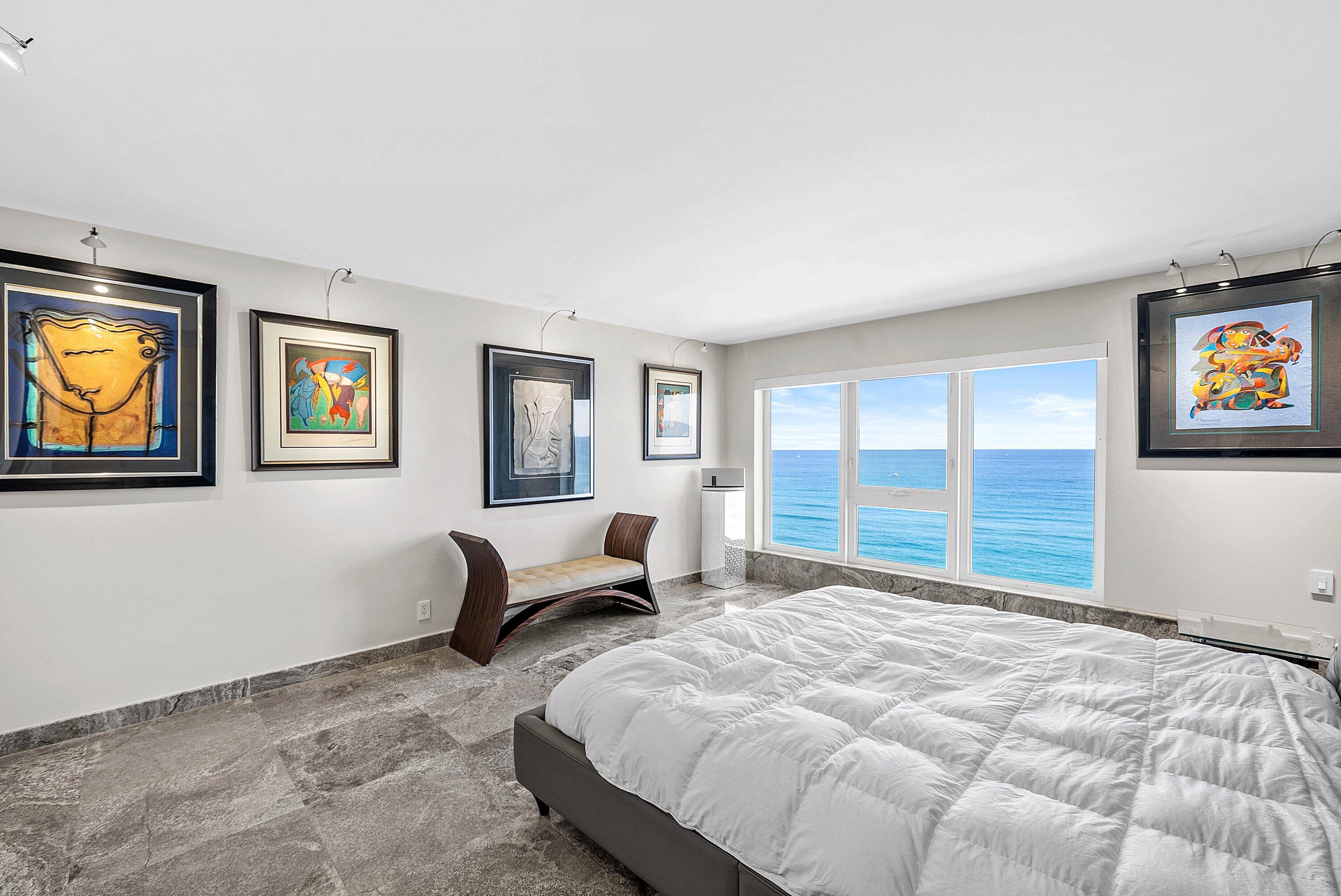 2066 North Ocean Boulevard, Unit 9NE Boca Raton, FL 33431 - Photo 17 of 45 a bedroom with a large bed and a couch