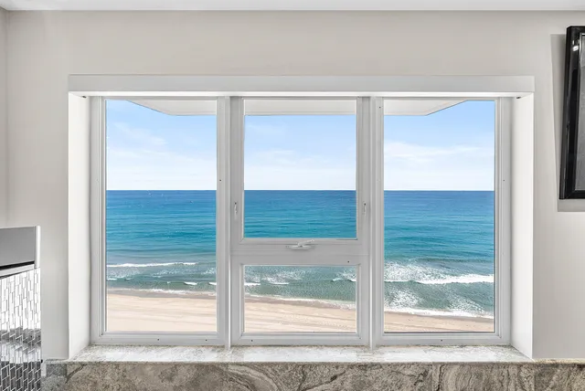 a view of swimming pool with a table and chairs