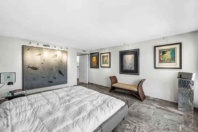 a swimming pool with outdoor seating and a garden