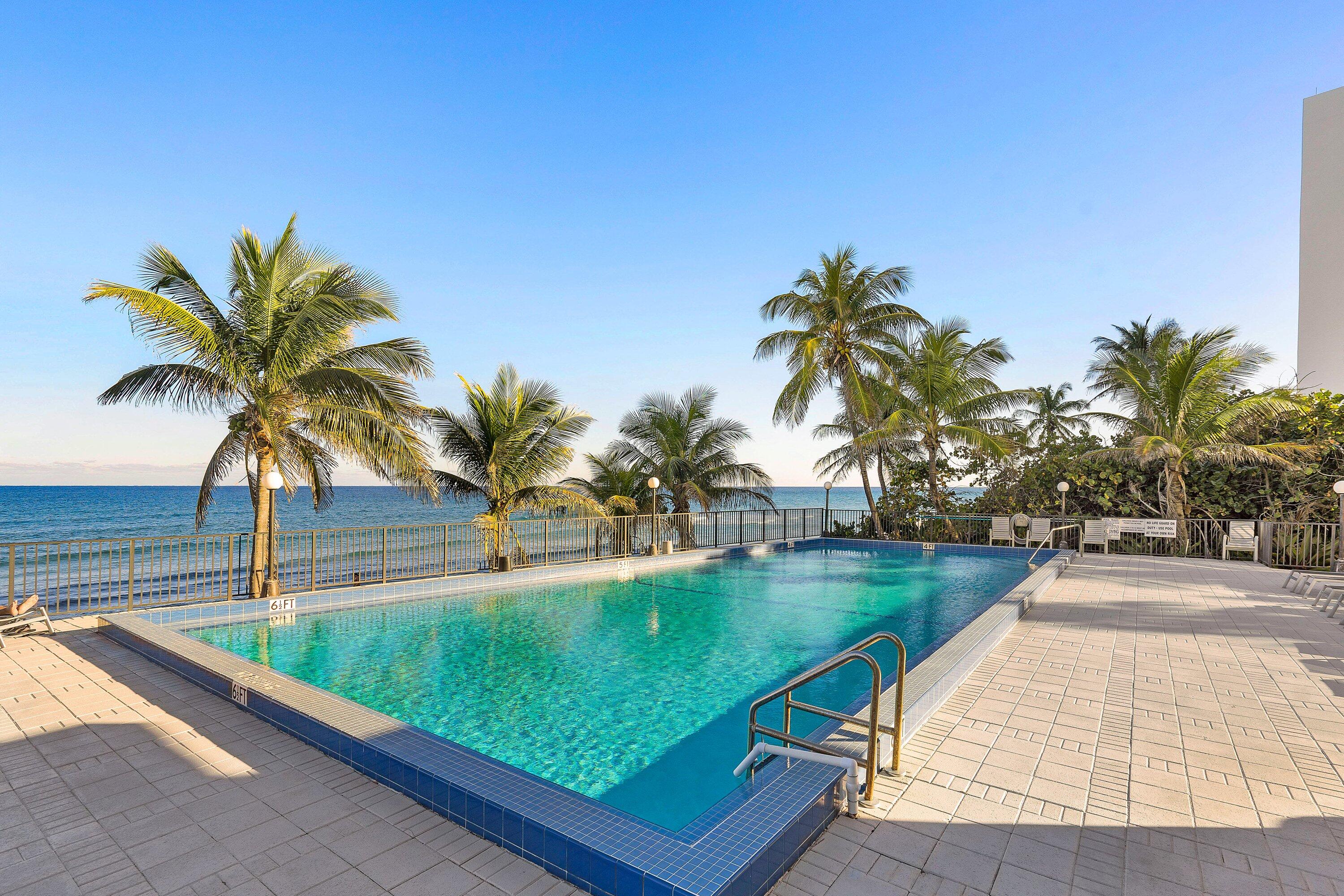 2066 North Ocean Boulevard, Unit 9NE Boca Raton, FL 33431 - Photo 29 of 45 a view of swimming pool with a table and chairs