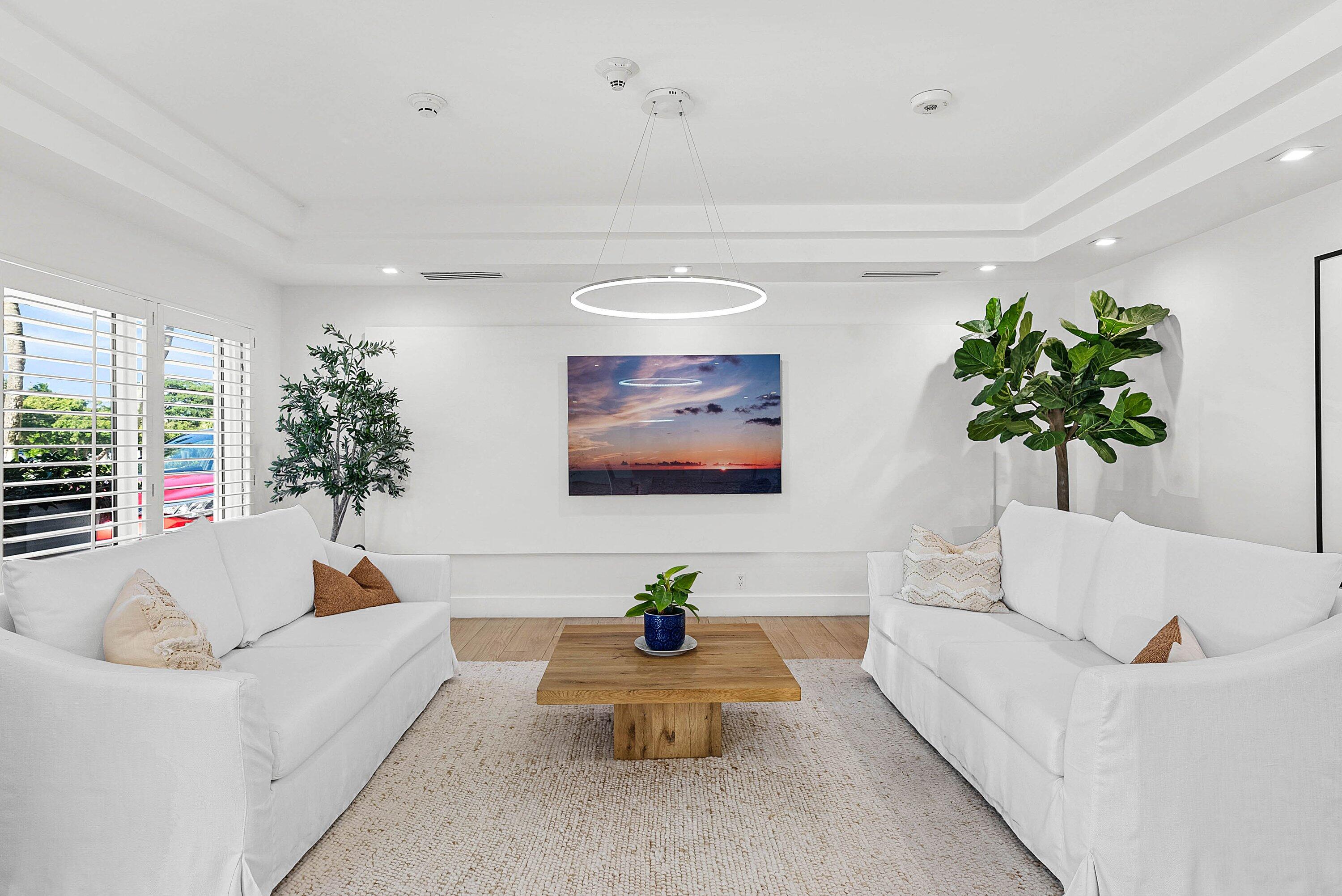 2066 North Ocean Boulevard, Unit 9NE Boca Raton, FL 33431 - Photo 35 of 45 a living room with furniture and a potted plant