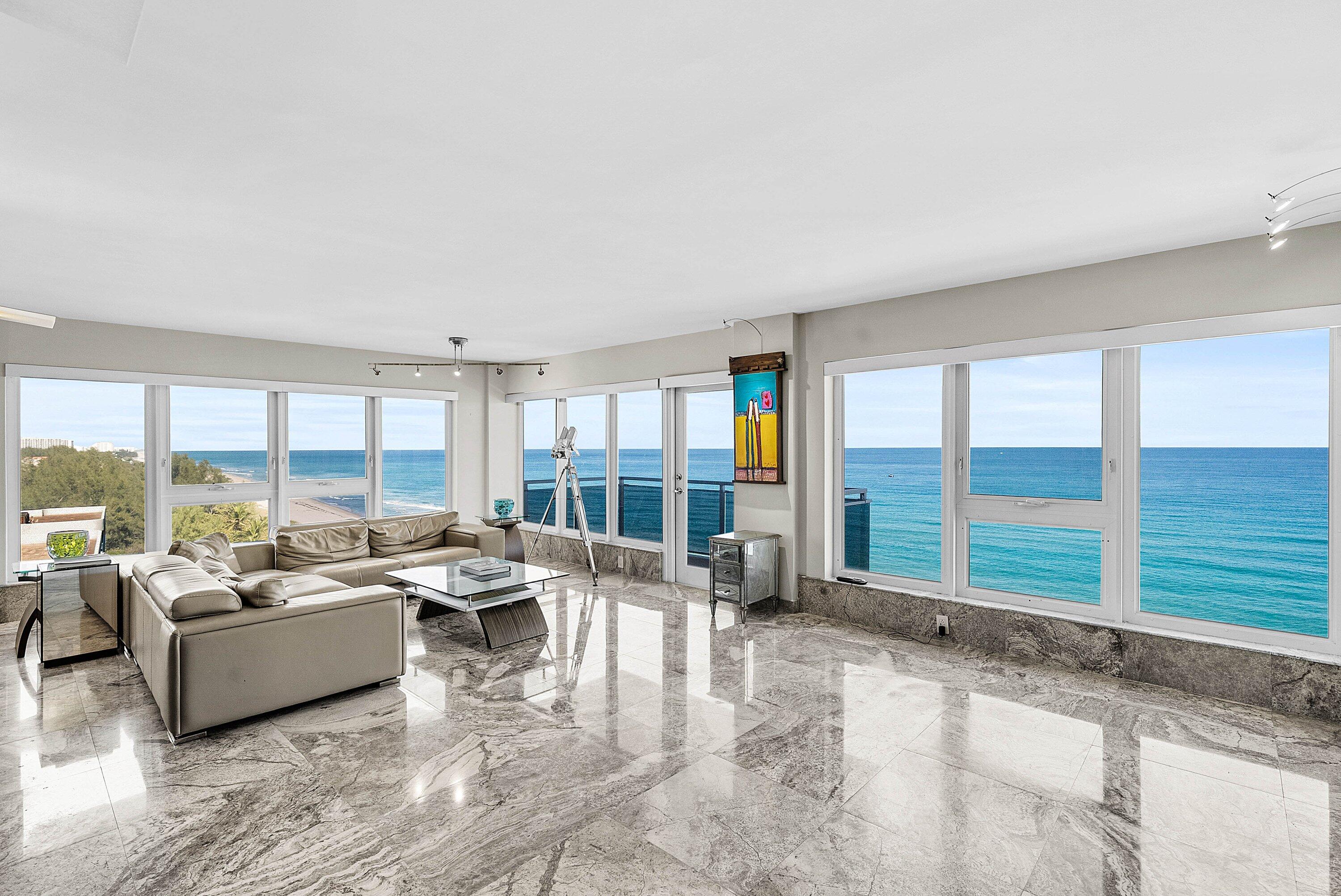 2066 North Ocean Boulevard, Unit 9NE Boca Raton, FL 33431 - Photo 5 of 45 a living room with furniture and large windows
