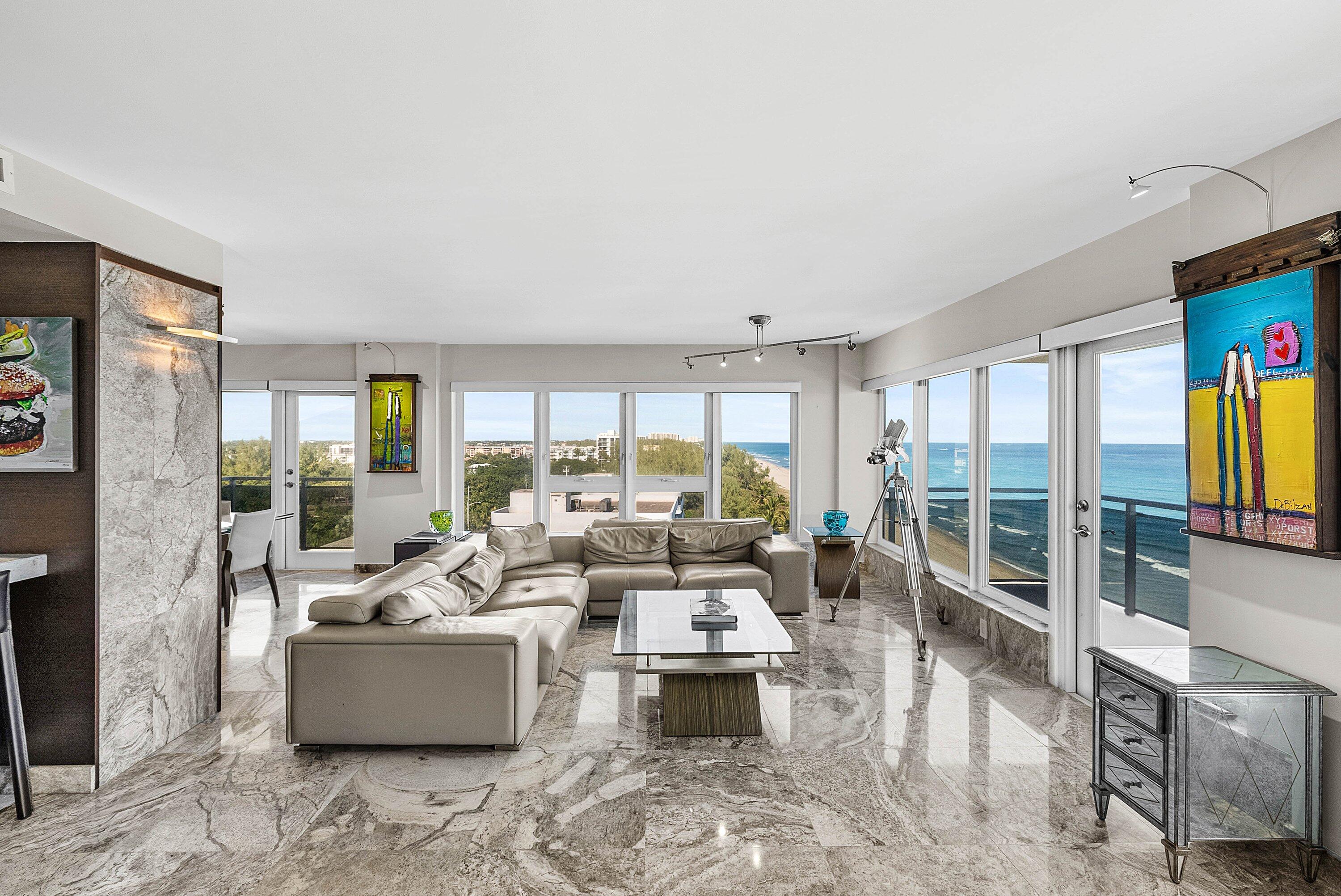 2066 North Ocean Boulevard, Unit 9NE Boca Raton, FL 33431 - Photo 6 of 45 a living room with fireplace furniture and a large window