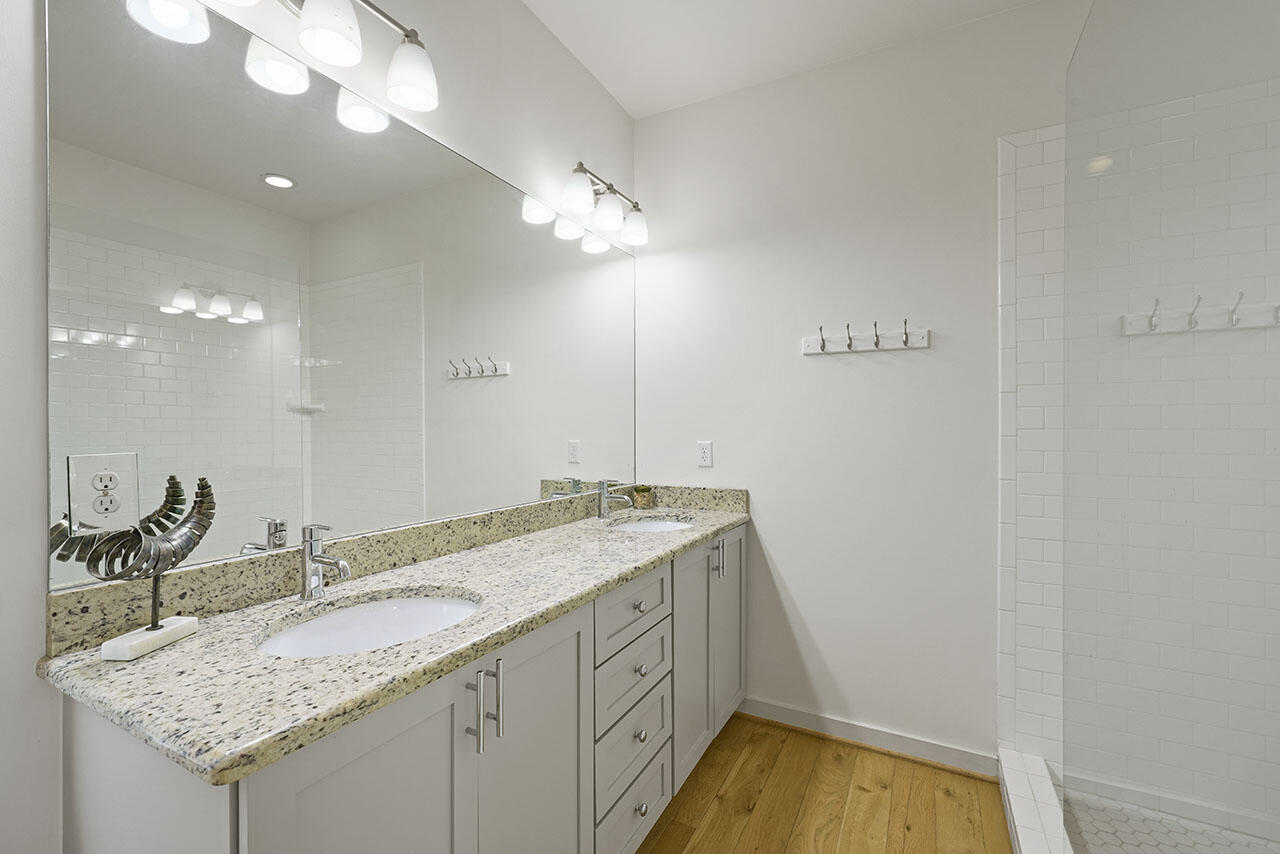 54 Dune Drive Santa Rosa Beach, FL 32459 - Photo 13 of 42 a bathroom with a granite countertop sink and a mirror