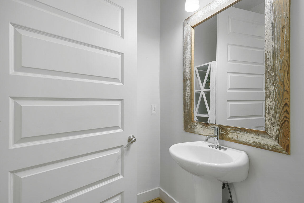 54 Dune Drive Santa Rosa Beach, FL 32459 - Photo 14 of 42 a bathroom with a sink a toilet and mirror