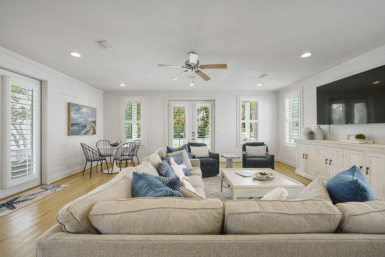 54 Dune Drive Santa Rosa Beach, FL 32459 - Photo 16 of 42 a living room with furniture and a flat screen tv