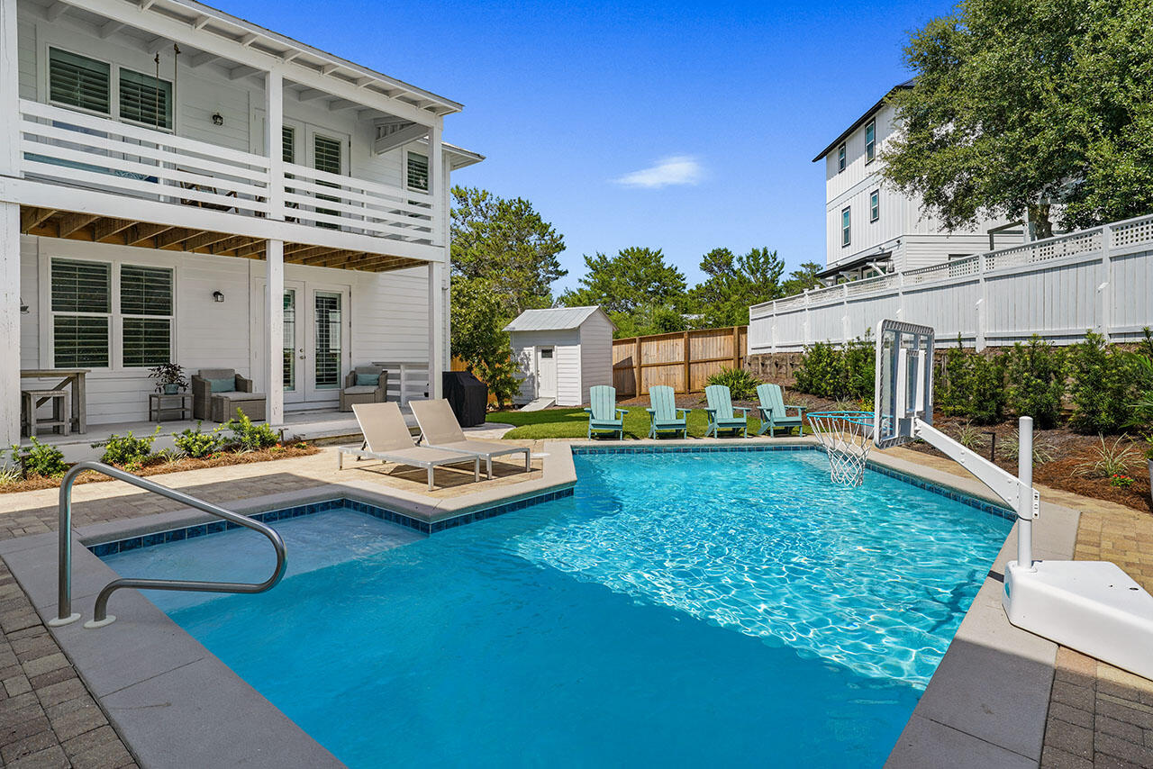 54 Dune Drive Santa Rosa Beach, FL 32459 - Photo 2 of 42 a view of a house with swimming pool and sitting area