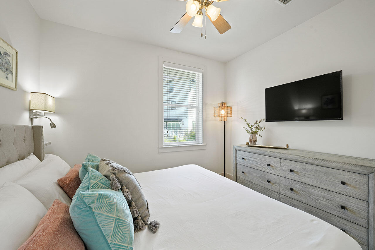54 Dune Drive Santa Rosa Beach, FL 32459 - Photo 21 of 42 a bedroom with a bed and a flat screen tv