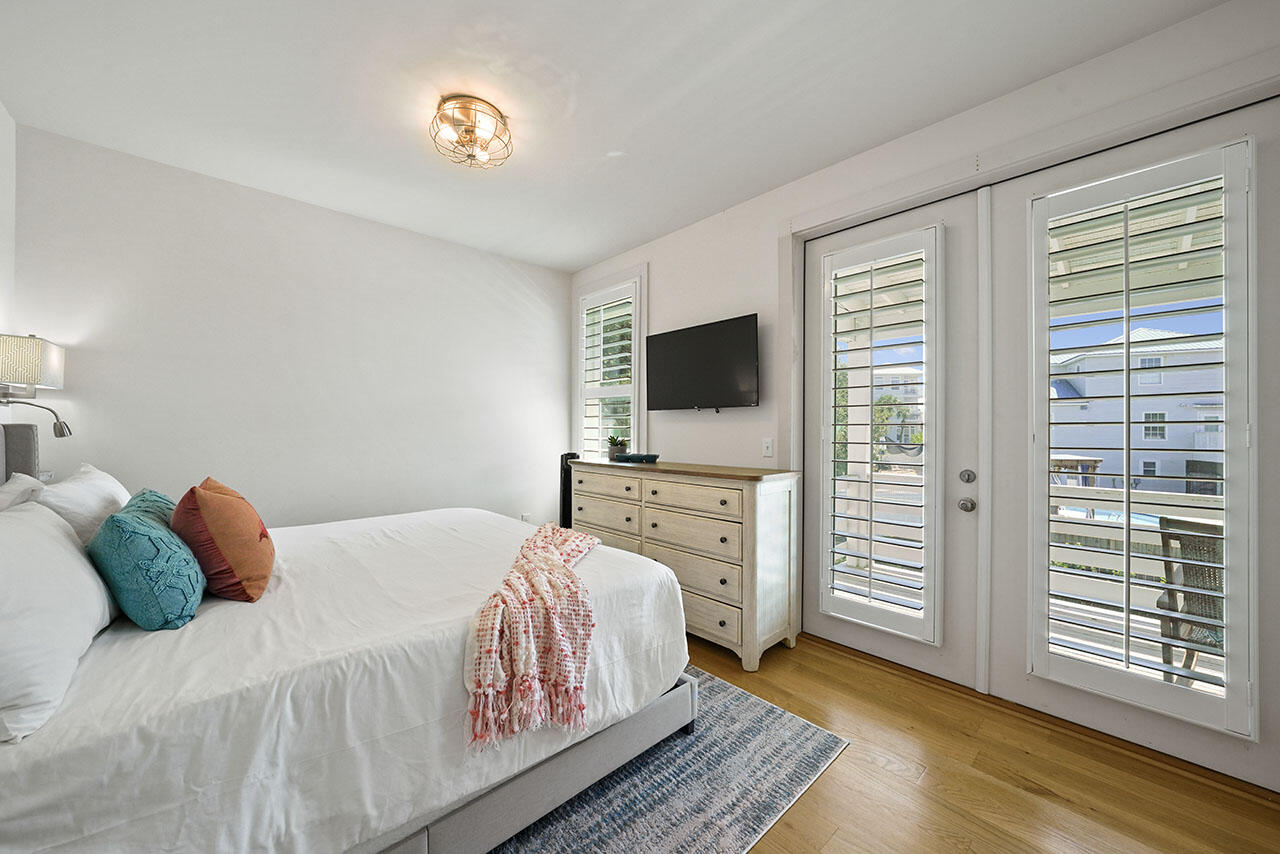 54 Dune Drive Santa Rosa Beach, FL 32459 - Photo 22 of 42 a bedroom with a bed and a television