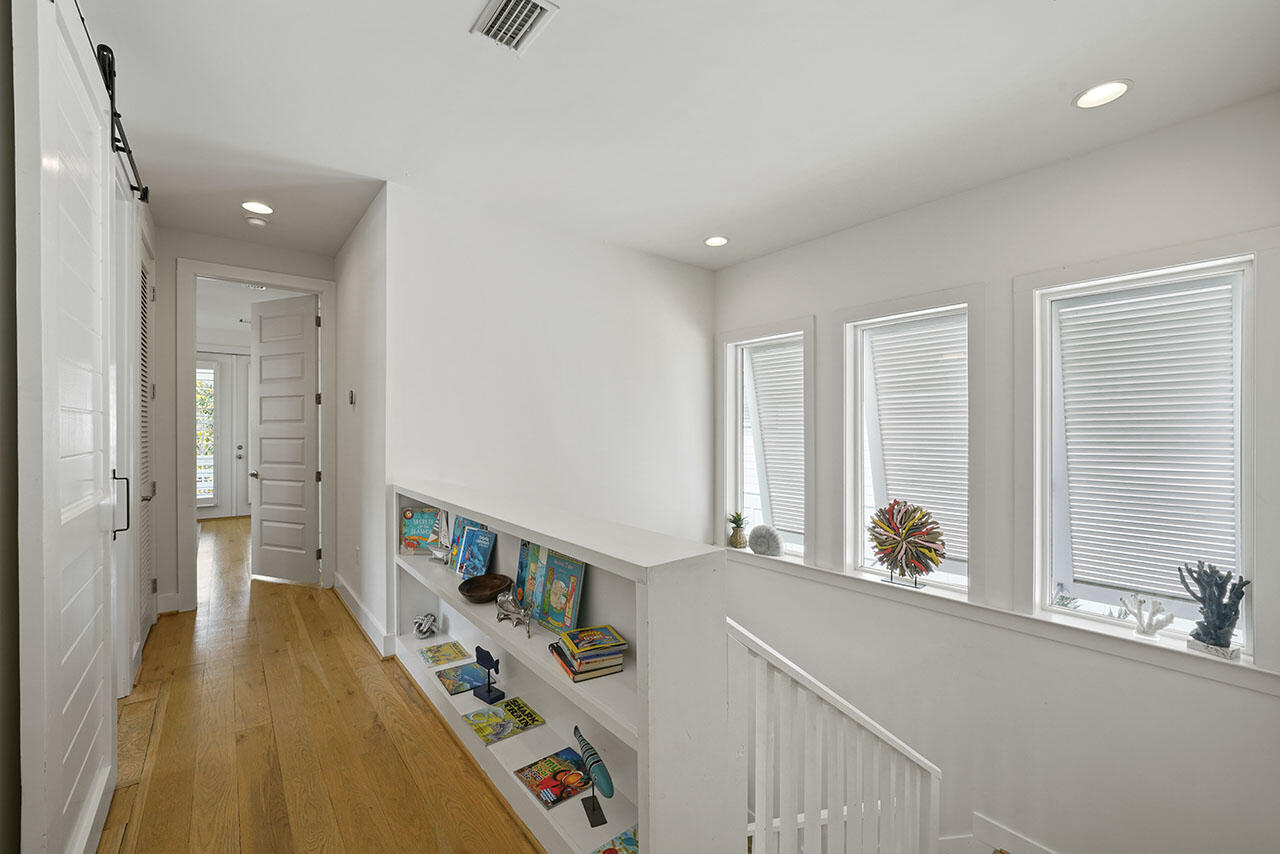 54 Dune Drive Santa Rosa Beach, FL 32459 - Photo 24 of 42 a view of an entryway with wooden floor and windows