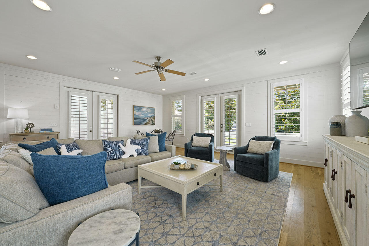 54 Dune Drive Santa Rosa Beach, FL 32459 - Photo 3 of 42 a living room with furniture fireplace and a large window
