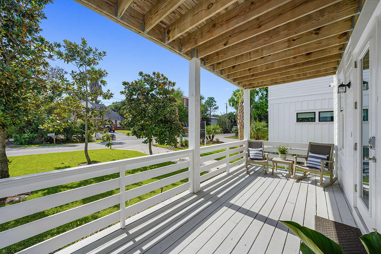 54 Dune Drive Santa Rosa Beach, FL 32459 - Photo 39 of 42 a view of balcony with chairs and wooden floor