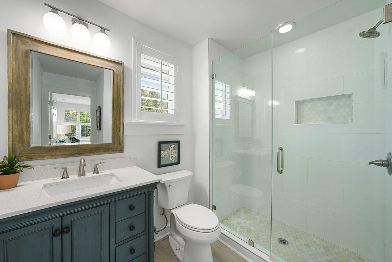54 Dune Drive Santa Rosa Beach, FL 32459 - Photo 7 of 42 a bathroom with a sink a toilet and shower